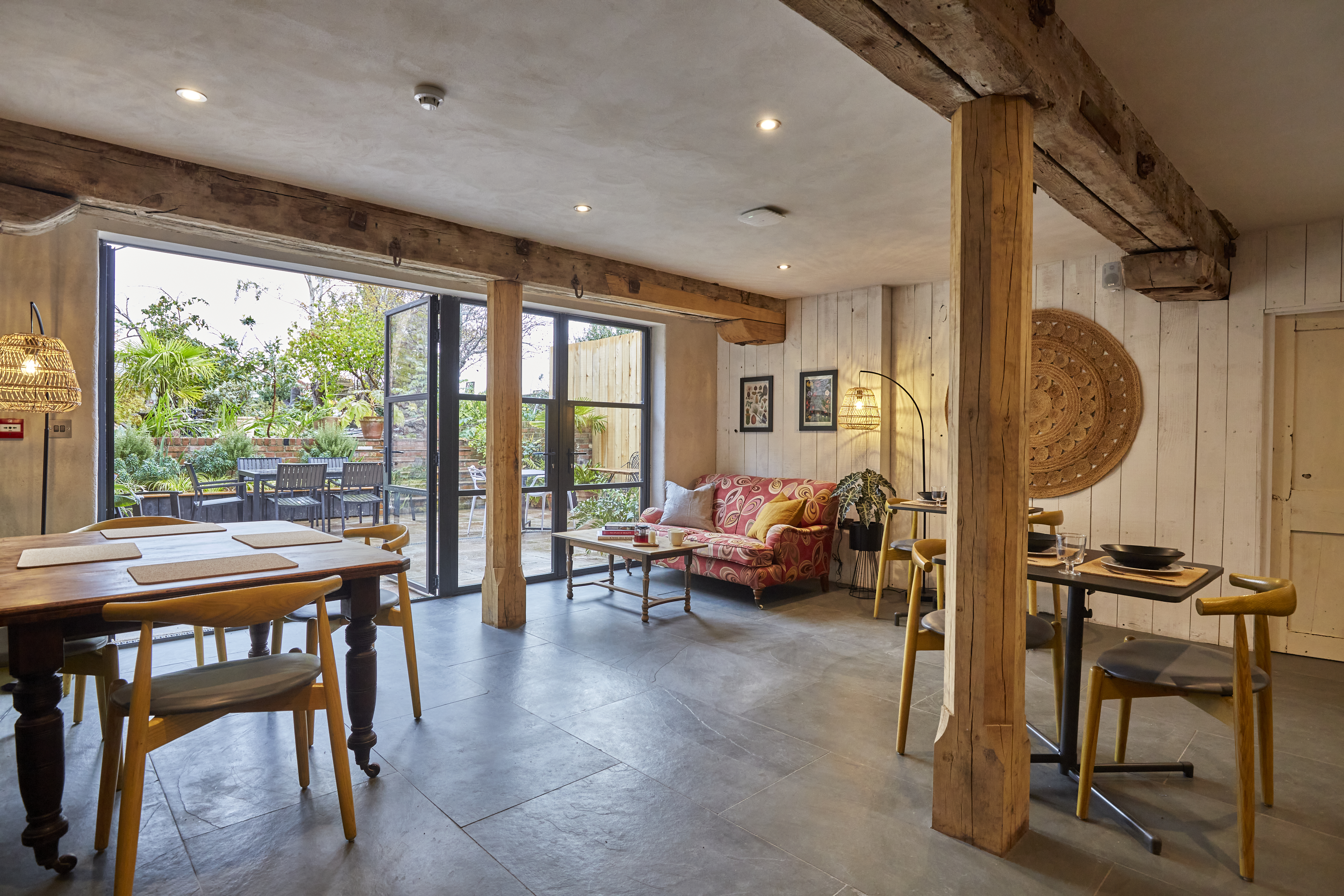 The back room of the cafe with doors open onto the garden