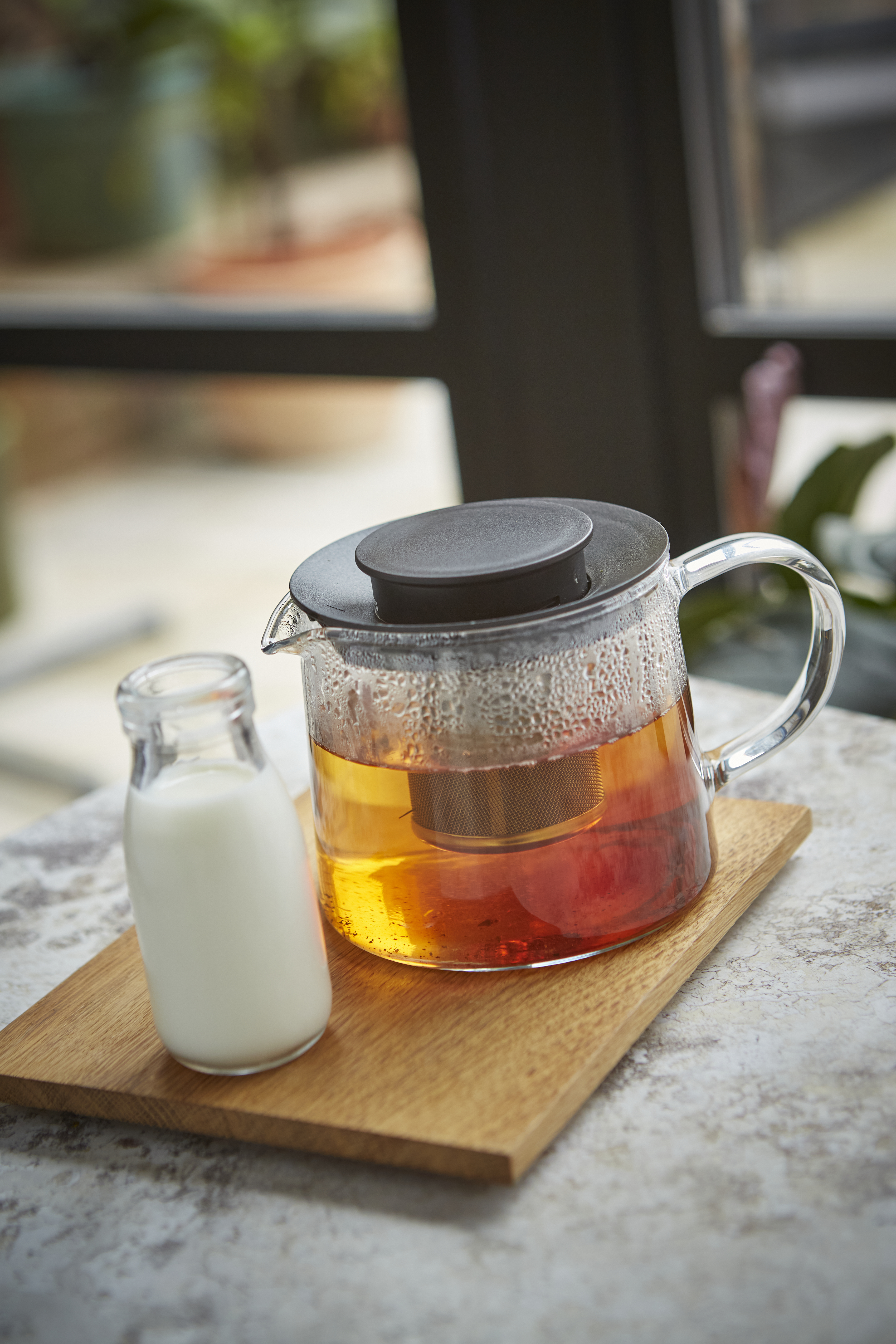A glass pot of tea, ready to drink